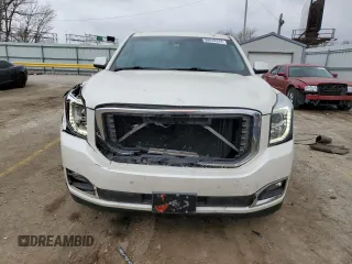 2015 GMC Yukon Denali with VIN 1GKS1CKJ1FR619793, listed as a Copart auction lot 86910314 with 128,559 mi miles and Salvage Title. Bid and sale history available at carsss.com. Image 5.