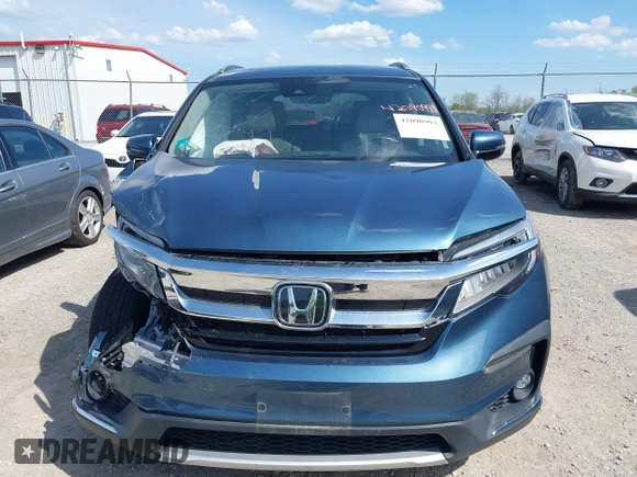 2020 Honda Pilot Touring 8-Passenger with VIN 5FNYF6H93LB034009, listed as a IAAI auction lot 42090993 with 73,325 mi miles and . Bid and sale history available at carsss.com. Image 12.