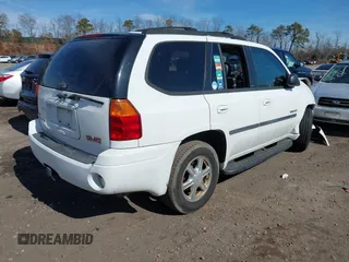 2006 GMC Envoy SLE with VIN 1GKDT13S662355509, listed as a IAAI auction lot 41628732 with 187,635 mi miles. Bid and sale history available at carsss.com. Image 4.