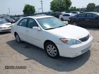 2002 Toyota Camry XLE z VIN 4T1BF30K22U007310, wystawiony jako IAAI lot #42419765 z przebiegiem 206 050 mil mil oraz . Historia ofert i sprzedaży dostępna na DreamBid. Obrazek 1.