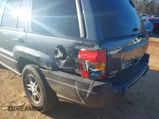 2004 Jeep Grand Cherokee Laredo z VIN 1J4GW48S24C159370, wystawiony jako IAAI lot #41296094 z przebiegiem 138 296 mil mil oraz . Historia ofert i sprzedaży dostępna na DreamBid. Obrazek 6.