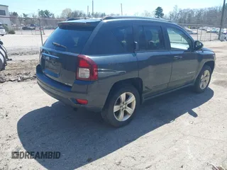 2014 Jeep Compass Sport with VIN 1C4NJDBB4ED689503, listed as a IAAI auction lot 42079098 with 104,433 mi miles. Bid and sale history available at carsss.com. Image 4.