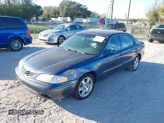 2002 Mazda 626 LX with VIN 1YVGF22D925287959, listed as a IAAI auction lot 41610932 with 122,333 mi miles. Bid and sale history available at carsss.com. Image 2.