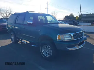 1998 Ford Expedition XLT z VIN 1FMPU18L2WLB65008, wystawiony jako IAAI lot #41232319 z przebiegiem 138 128 mil mil oraz . Historia ofert i sprzedaży dostępna na DreamBid. Obrazek 1.