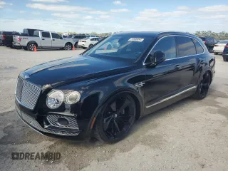 2018 Bentley Bentayga Signature z VIN SJAAC2ZV9JC018049, wystawiony jako Copart lot #74990894 z przebiegiem 28 749 mil mil oraz Nie do naprawy. Historia ofert i sprzedaży dostępna na DreamBid. Obrazek 1.