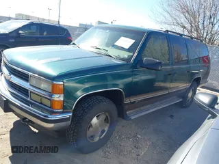 1997 Chevrolet Suburban with VIN 3GNFK16R9VG184722, listed as a IAAI auction lot 41662635 with 176,652 mi miles. Bid and sale history available at carsss.com. Image 2.