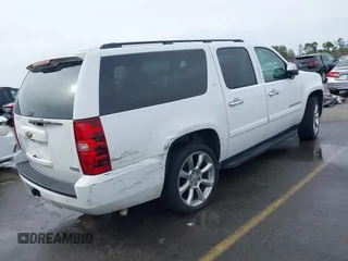 2008 Chevrolet Suburban LTZ with VIN 1GNFC16018R143195, listed as a IAAI auction lot 41577367 with 223,506 mi miles and . Bid and sale history available at DreamBid. Image 4.