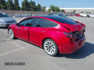 2021 Tesla Model 3 Long Range with VIN 5YJ3E1EB4MF936743, listed as a IAAI auction lot 42154322 with 46,983 mi miles and . Bid and sale history available at DreamBid. Image 3.