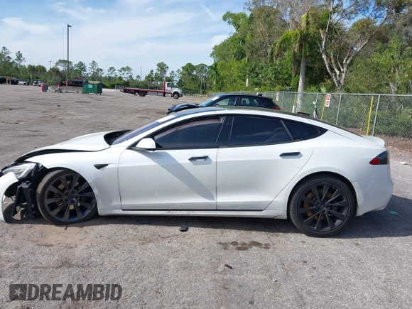 2020 Tesla Model S Long Range with VIN 5YJSA1E2XLF360260, listed as a IAAI auction lot 41241778 with 141,594 mi miles. Bid and sale history available at carsss.com. Image 14.