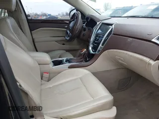 2013 Cadillac SRX Performance Collection with VIN 3GYFNHE34DS595277, listed as a IAAI auction lot 41618126 with 118,141 mi miles. Bid and sale history available at carsss.com. Image 5.