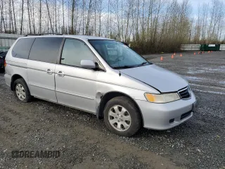 2002 Honda Odyssey EX z VIN 2HKRL18692H578746, wystawiony jako Copart lot #51281845 z przebiegiem 282 844 mil mil oraz Szkoda całkowita • Salvage title. Historia ofert i sprzedaży dostępna na DreamBid. Obrazek 4.