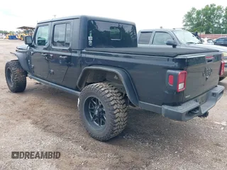 2021 Jeep Gladiator Sport S with VIN 1C6JJTAM7ML554412, listed as a IAAI auction lot 42199167 with 74,263 mi miles and . Bid and sale history available at DreamBid. Image 3.
