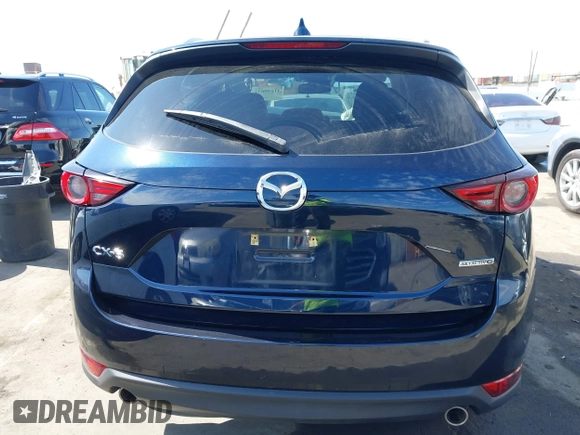 2020 Mazda CX-5 Grand Touring with VIN JM3KFADM6L1830093, listed as a IAAI auction lot 41699672 with 66,769 mi miles. Bid and sale history available at carsss.com. Image 17.