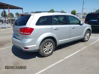 2014 Dodge Journey SXT z VIN 3C4PDDBG8ET212188, wystawiony jako IAAI lot #42101266 z przebiegiem 101 553 mil mil oraz . Historia ofert i sprzedaży dostępna na DreamBid. Obrazek 4.