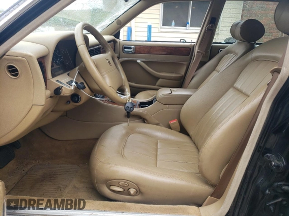 1997 Jaguar XJ with VIN SAJHX6248VC806189, listed as a Copart auction lot 57891035 with 51,654 mi miles and Salvage title. Bid and sale history available at DreamBid. Image 7.