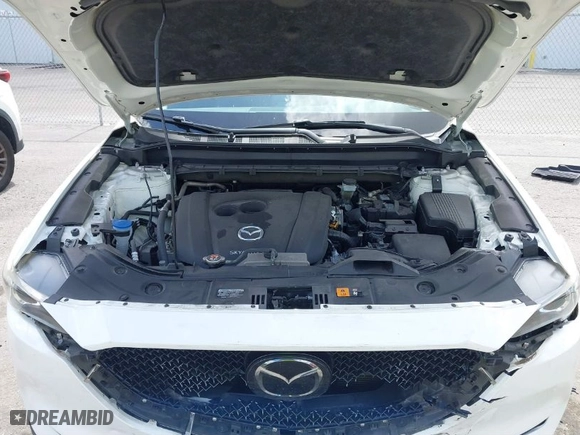 2020 Mazda CX-5 Touring with VIN JM3KFACM6L1820441, listed as a IAAI auction lot 41579634 with 55,416 mi miles. Bid and sale history available at carsss.com. Image 10.