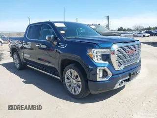 2021 GMC Sierra 1500 Denali z VIN 3GTU9FET6MG282708, wystawiony jako IAAI lot #38941962 z przebiegiem 63 501 mil mil oraz . Historia ofert i sprzedaży dostępna na DreamBid. Obrazek 1.
