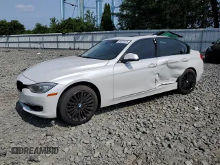 2015 BMW 3 Series 328i xDrive with VIN WBA3B3G52FNT19323, listed as a Copart auction lot 61873015 with 110,893 mi miles and Salvage title. Bid and sale history available at DreamBid. Image 1.