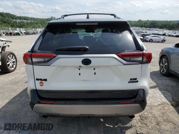 2023 Toyota RAV4 Hybrid XSE with VIN 2T3E6RFVXPW040152, listed as a Copart auction lot 61645565 with 26,408 mi miles and Salvage title. Bid and sale history available at DreamBid. Image 6.