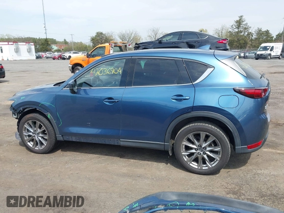 2019 Mazda CX-5 Signature with VIN JM3KFBEY1K0512880, listed as a IAAI auction lot 42036904 with 92,650 mi miles. Bid and sale history available at carsss.com. Image 15.