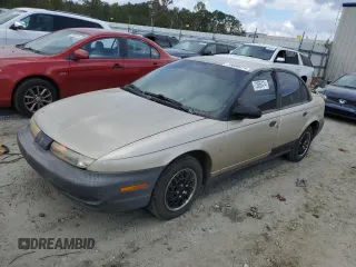 1999 Saturn SL with VIN 1G8ZH5280XZ178863, listed as a Copart auction lot 73660474 with 195,738 mi miles and Salvage Title. Bid and sale history available at carsss.com. Image 1.