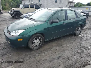 2000 Ford Focus SE with VIN 1FAFP3433YW354797, listed as a Copart auction lot 61430265 with 165,202 mi miles and Salvage title. Bid and sale history available at DreamBid. Image 1.