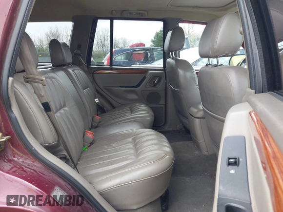 1999 Jeep Grand Cherokee Limited with VIN 1J4GW68N5XC642670, listed as a IAAI auction lot 41990199 with 154,492 mi miles. Bid and sale history available at carsss.com. Image 8.