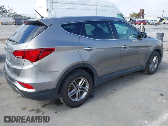 2018 Hyundai Santa Fe 2.4L with VIN 5NMZT3LB4JH069868, listed as a IAAI auction lot 42675555 with 142,612 mi miles and . Bid and sale history available at DreamBid. Image 4.