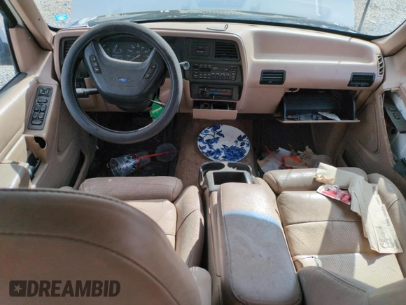 1992 Ford Explorer Eddie Bauer with VIN 1FMDU34X2NUE11927, listed as a Copart auction lot 52094875 with 53,449 mi miles and Salvage title. Bid and sale history available at DreamBid. Image 8.