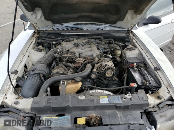 2004 Ford Mustang Deluxe z VIN 1FAFP44454F123067, wystawiony jako Copart lot #86784474 z przebiegiem 161 541 mil mil oraz Szkoda całkowita • Salvage title. Historia ofert i sprzedaży dostępna na DreamBid. Obrazek 11.