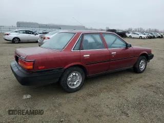 1990 Toyota Camry z VIN JT2SV24E4L3422585, wystawiony jako Copart lot #84872844 z przebiegiem 119 987 mil mil oraz Szkoda całkowita • Salvage title. Historia ofert i sprzedaży dostępna na DreamBid. Obrazek 3.