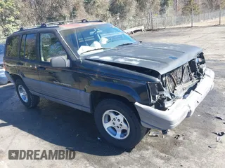 1996 Jeep Grand Cherokee Laredo with VIN 1J4GZ58S9TC268615, listed as a IAAI auction lot 41527984 with 248,443 mi miles. Bid and sale history available at carsss.com. Image 1.