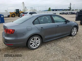 2014 Volkswagen Jetta GLI z VIN 3VW4T7AJ2EM245201, wystawiony jako Copart lot #64901935 z przebiegiem 147 799 mil mil oraz Czysty tytuł • Clean title. Historia ofert i sprzedaży dostępna na DreamBid. Obrazek 3.