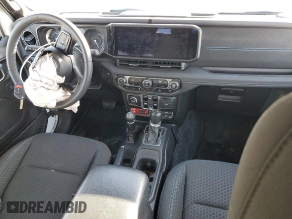 2024 Jeep Wrangler Rubicon with VIN 1C4RJXR6XRW115879, listed as a Copart auction lot 45816825 with 34,557 mi miles and Salvage Title. Bid and sale history available at DreamBid. Image 8.