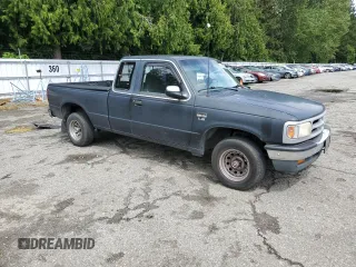 1994 Mazda B-Series Truck LE z VIN 4F4CR16X7RTM18152, wystawiony jako Copart lot #56992165 z przebiegiem 238 802 mil mil oraz Szkody całkowita. Historia ofert i sprzedaży dostępna na DreamBid. Obrazek 4.