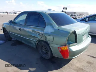 2005 Hyundai Accent GLS with VIN KMHCG45C95U620716, listed as a IAAI auction lot 41740573 with 187,971 mi miles. Bid and sale history available at carsss.com. Image 6.