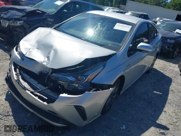 2020 Toyota Prius L Eco z VIN JTDKARFUXL3125434, wystawiony jako IAAI lot #42201623 z przebiegiem 58 609 mil mil oraz . Historia ofert i sprzedaży dostępna na DreamBid. Obrazek 2.