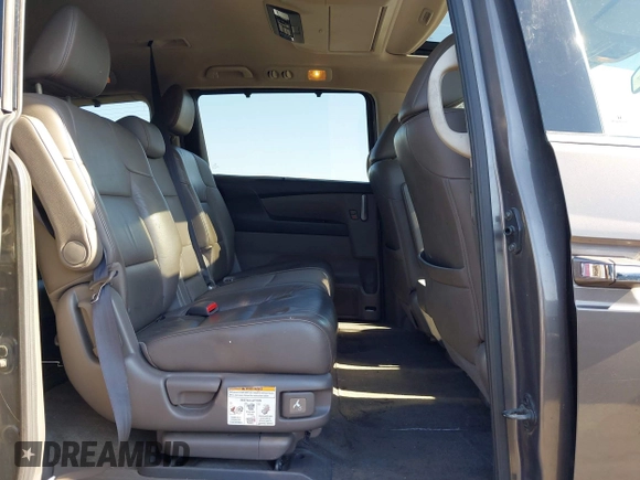 2012 Honda Odyssey Touring with VIN 5FNRL5H95CB057346, listed as a IAAI auction lot 42644094 with 114,712 mi miles and . Bid and sale history available at DreamBid. Image 8.