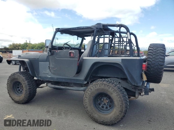 1990 Jeep Wrangler with VIN 2J4FY29T5LJ537896, listed as a Copart auction lot 57021295 with 143,753 mi miles and Clean title. Bid and sale history available at DreamBid. Image 2.