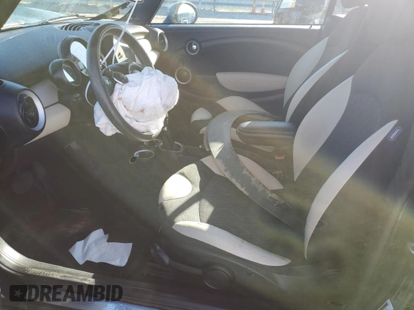 2015 MINI Convertible with VIN WMWZN3C53FT862148, listed as a Copart auction lot 76911714 with 56,065 mi miles and Salvage title. Bid and sale history available at DreamBid. Image 7.