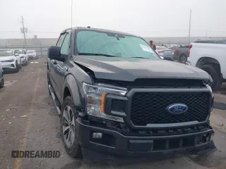 2019 Ford F-150 XL with VIN 1FTEW1CP7KKD80786, listed as a IAAI auction lot 41117065 with 142,011 mi miles and . Bid and sale history available at carsss.com. Image 1.