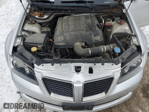 2009 Pontiac G8 z VIN 6G2ER57729L223218, wystawiony jako Copart lot #84234214 z przebiegiem 222 165 mil mil oraz Szkoda całkowita • Salvage title. Historia ofert i sprzedaży dostępna na DreamBid. Obrazek 11.