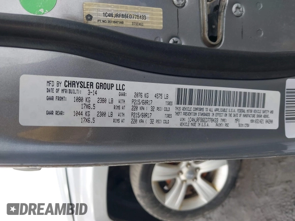 2014 Jeep Patriot Latitude with VIN 1C4NJRFB6ED778433, listed as a IAAI auction lot 41211522 with 127,506 mi miles. Bid and sale history available at carsss.com. Image 9.