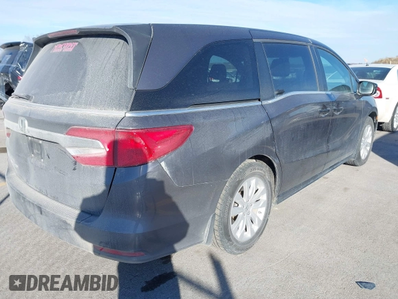 2019 Honda Odyssey LX with VIN 5FNRL6H21KB057139, listed as a IAAI auction lot 41422185 with 128,812 mi miles and . Bid and sale history available at DreamBid. Image 4.