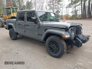 2023 Jeep Gladiator Sport S with VIN 1C6HJTAG0PL501578, listed as a IAAI auction lot 41912958 with 22,708 mi miles and . Bid and sale history available at DreamBid. Image 1.
