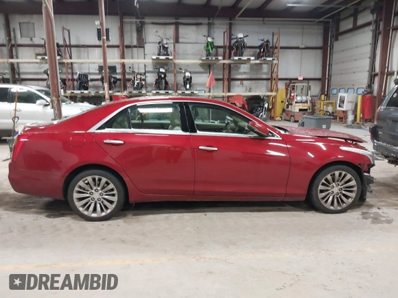 2016 Cadillac CTS Luxury Collection AWD z VIN 1G6AX5SX6G0124584, wystawiony jako IAAI lot #41235515 z przebiegiem 82 286 mil mil oraz . Historia ofert i sprzedaży dostępna na DreamBid. Obrazek 14.