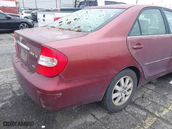 2004 Toyota Camry LE with VIN 4T1BF32K54U069705, listed as a IAAI auction lot 41809582 with 194,606 mi miles. Bid and sale history available at carsss.com. Image 12.
