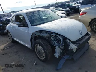 2014 Volkswagen Beetle 2.5L w/Sun with VIN 3VWJP7ATXEM628666, listed as a IAAI auction lot 41328014 with 70,990 mi miles and . Bid and sale history available at DreamBid. Image 1.
