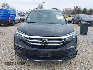 2017 Honda Pilot Touring with VIN 5FNYF6H90HB051700, listed as a IAAI auction lot 41902075 with 69,712 mi miles. Bid and sale history available at carsss.com. Image 13.