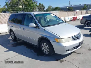 2002 Honda Odyssey EX z VIN 2HKRL186X2H513999, wystawiony jako IAAI lot #42348131 z przebiegiem 252 202 mil mil oraz . Historia ofert i sprzedaży dostępna na DreamBid. Obrazek 1.